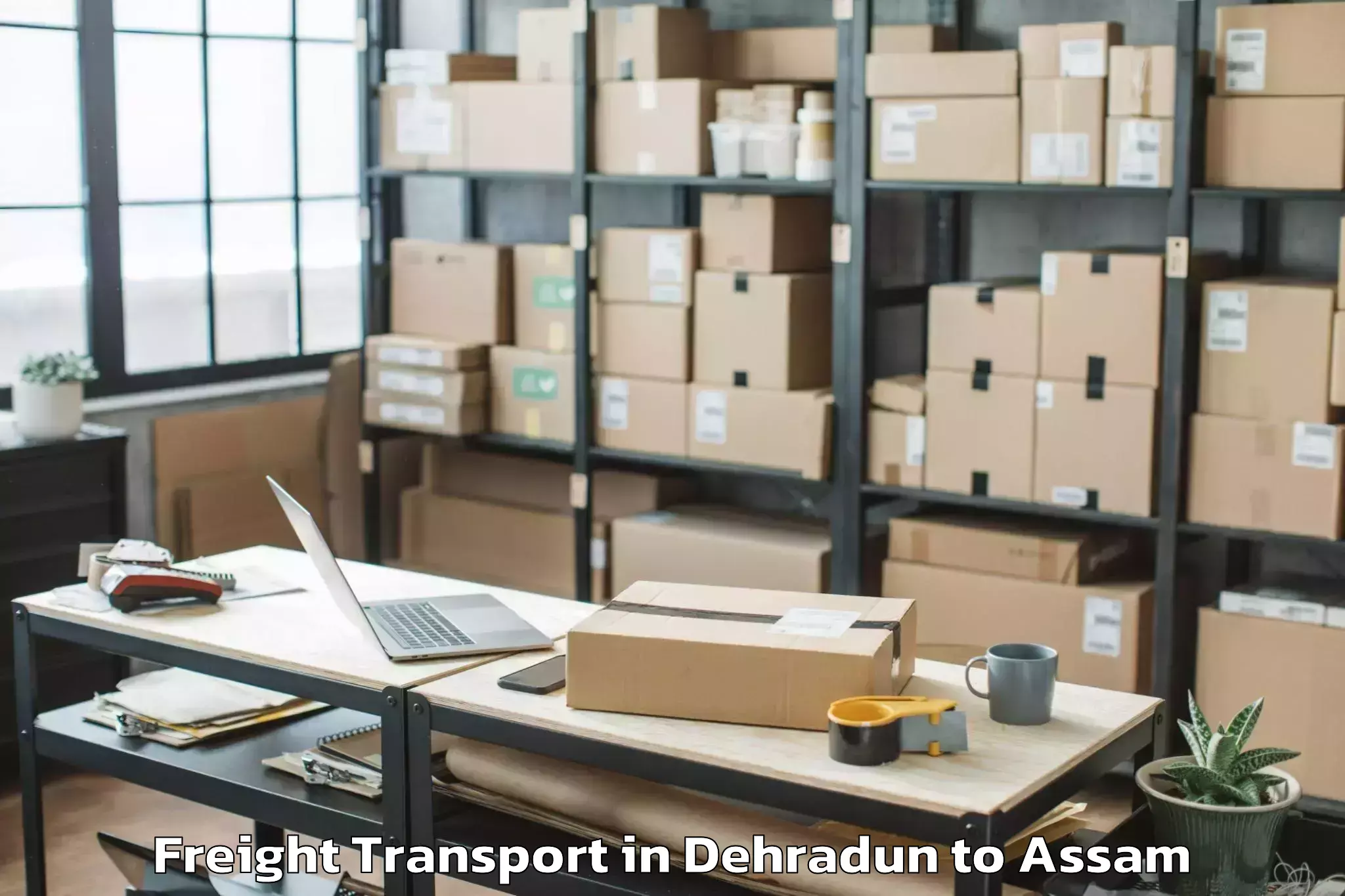 Trusted Dehradun to Golakganj Freight Transport